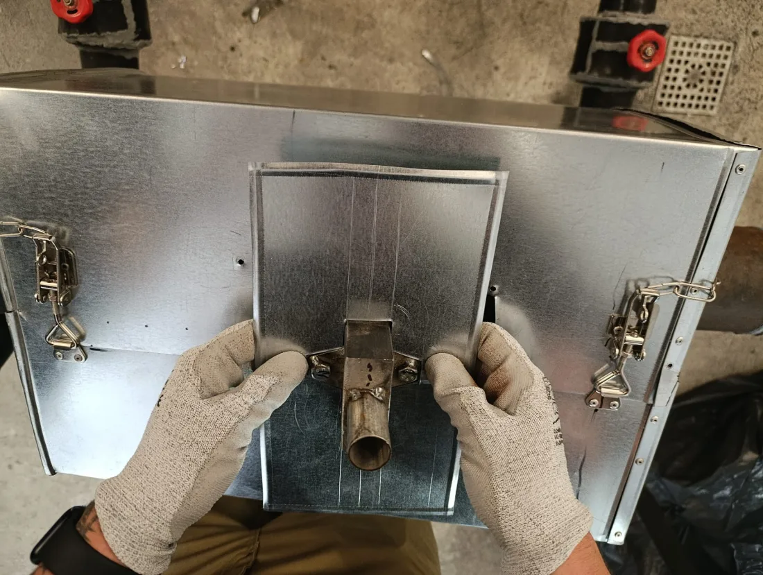 Fitting protective cladding on an industrial insulation element